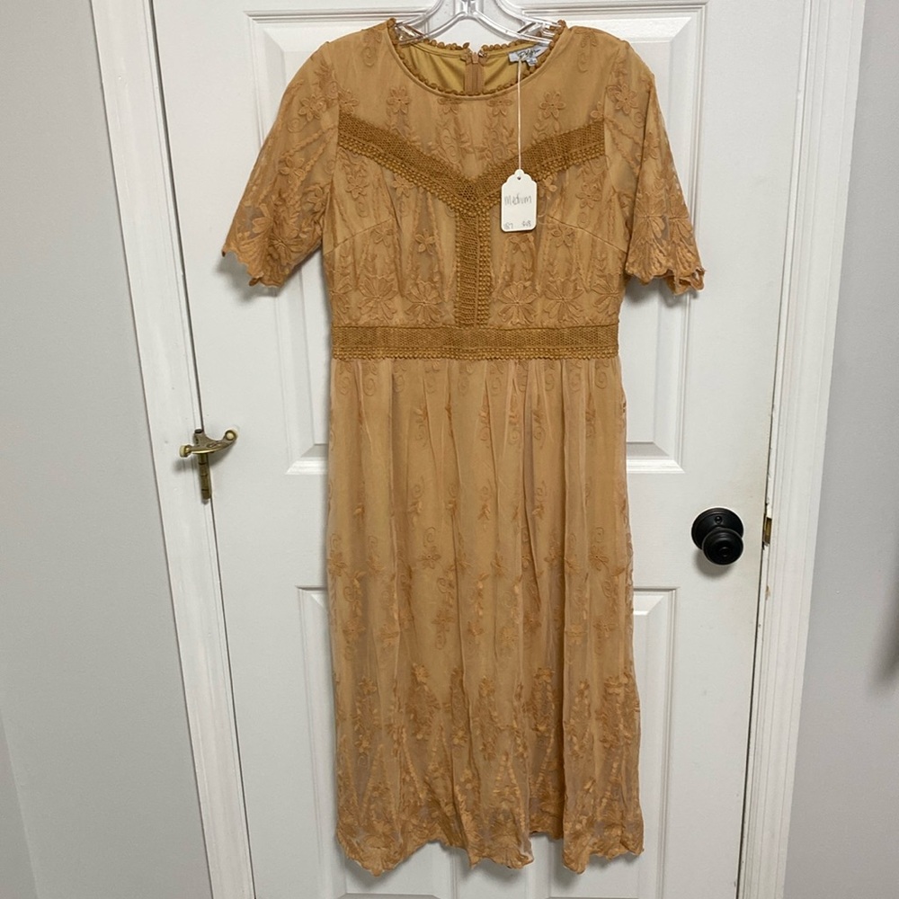 Never worn NWT Midi length dress! Perfect dress for fall.